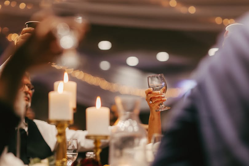Wedding Guests Raising Glass for Toast