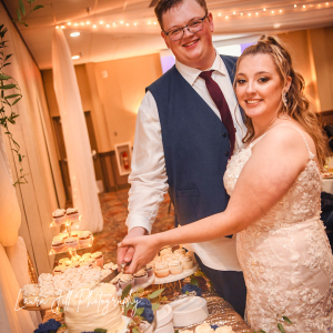 Wedding-Couple-Cutting-Cake-Laura-Jill-Photography